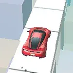 빨간 차가 높은 건물 사이의 흰색 도로를 달리고 있는 모습