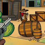 무장한 카우보이가 사막 마을에서 총을 겨누고 있는 모습