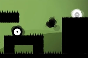 녹색 배경 위에 검정색 장애물과 흰 눈같은 캐릭터가 있는 장면