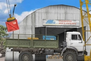 크레인으로 빨간 상자를 운반하고 있는 화물 트럭과 창고