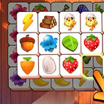 나무 바닥 위에 다양한 아이콘이 그려진 카드들이 놓여 있고, 손가락이 카드를 가리키고 있습니다