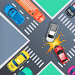 교차로에서 하얀색 차와 빨간색 차가 충돌한 모습