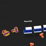 어두운 배경 위에 파란색과 흰색의 기차 모양의 도형이 이동하고 있으며, 주변에 눈에 띄는 형형색색의 작은 도형들과 오렌지색 물체들이 흩어져 있다