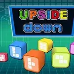 화면에 색색의 큐브들이 배경에 있고, 중앙 상단에 UPSIDE down라는 텍스트가 있는 이미지
