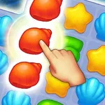 바다 조개와 별 모양의 퍼즐 조각들이 놓인 게임 화면에서 손가락으로 빨간 조개 조각을 가리키고 있는 모습