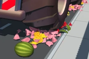 커다란 차량 바퀴가 분홍색과 노란색 과일 조각을 으깨고 있는 모습