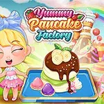 귀여운 소녀가 웃으며 과일과 초콜릿이 올라간 팬케이크와 알록달록한 배경 앞에 서 있다